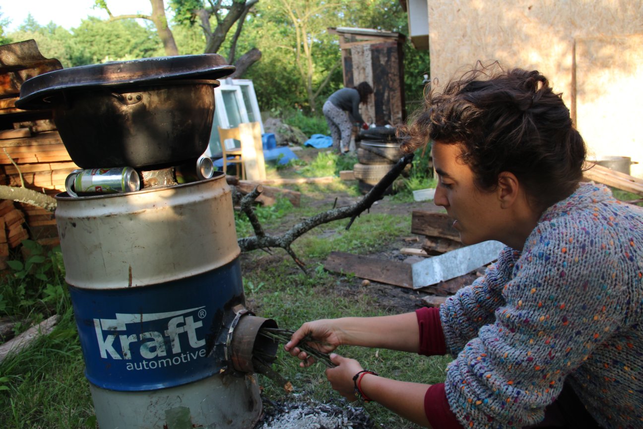 Feeding the Rocketstove. You have to do it non-stop if water should be boiled.