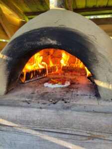 Pizza frying in a pizza oven.